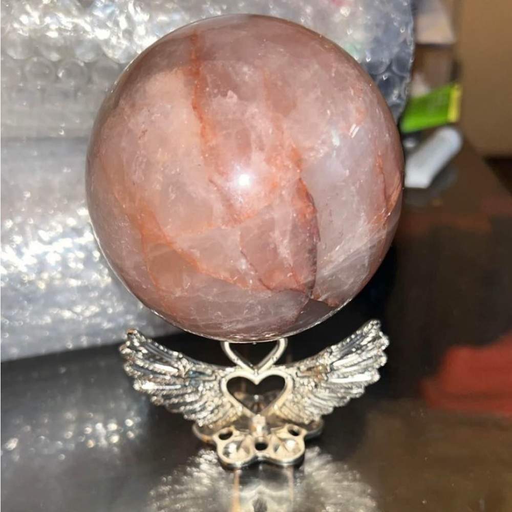 Fire quarts sphere with heart stand.